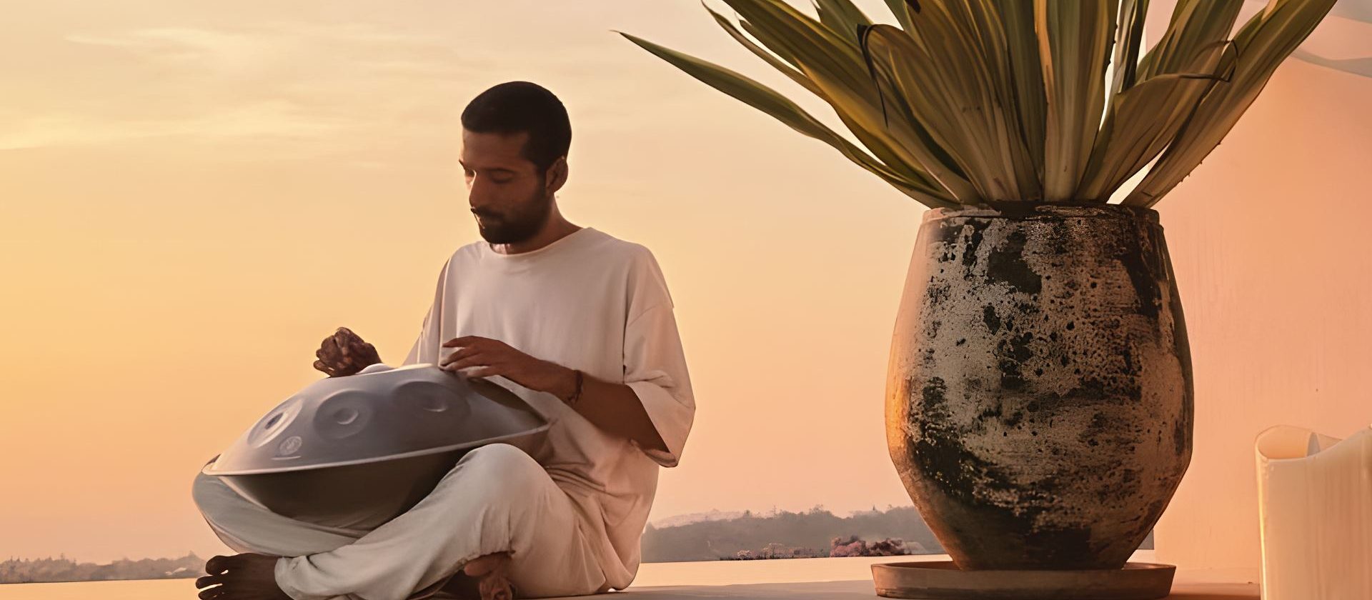 Can playing handpan at sunset in Koh Samui