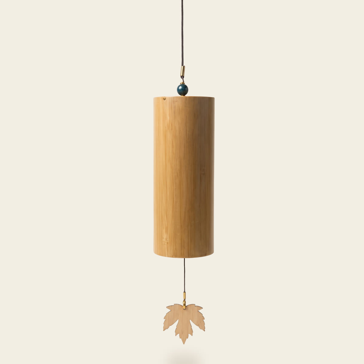 Bamboo wind chime with a blue bead and a bamboo leaf sail