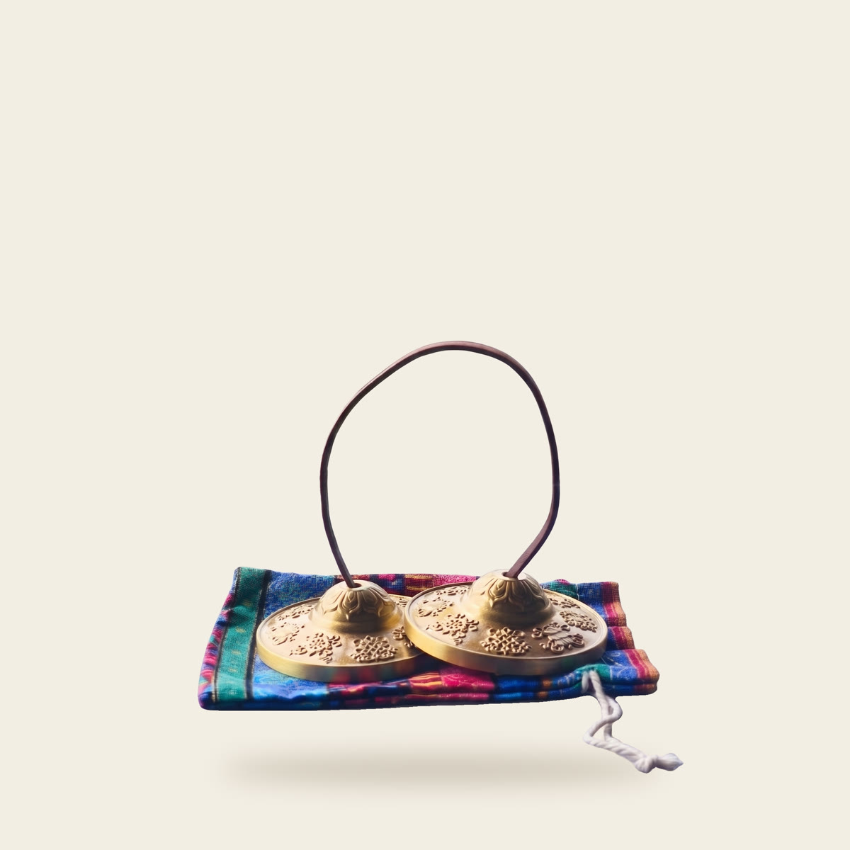 Tingsha, a pair of small hand cymbals on a cord with a cloth pouch